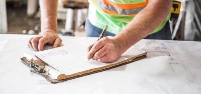 Man filling out recycling audit